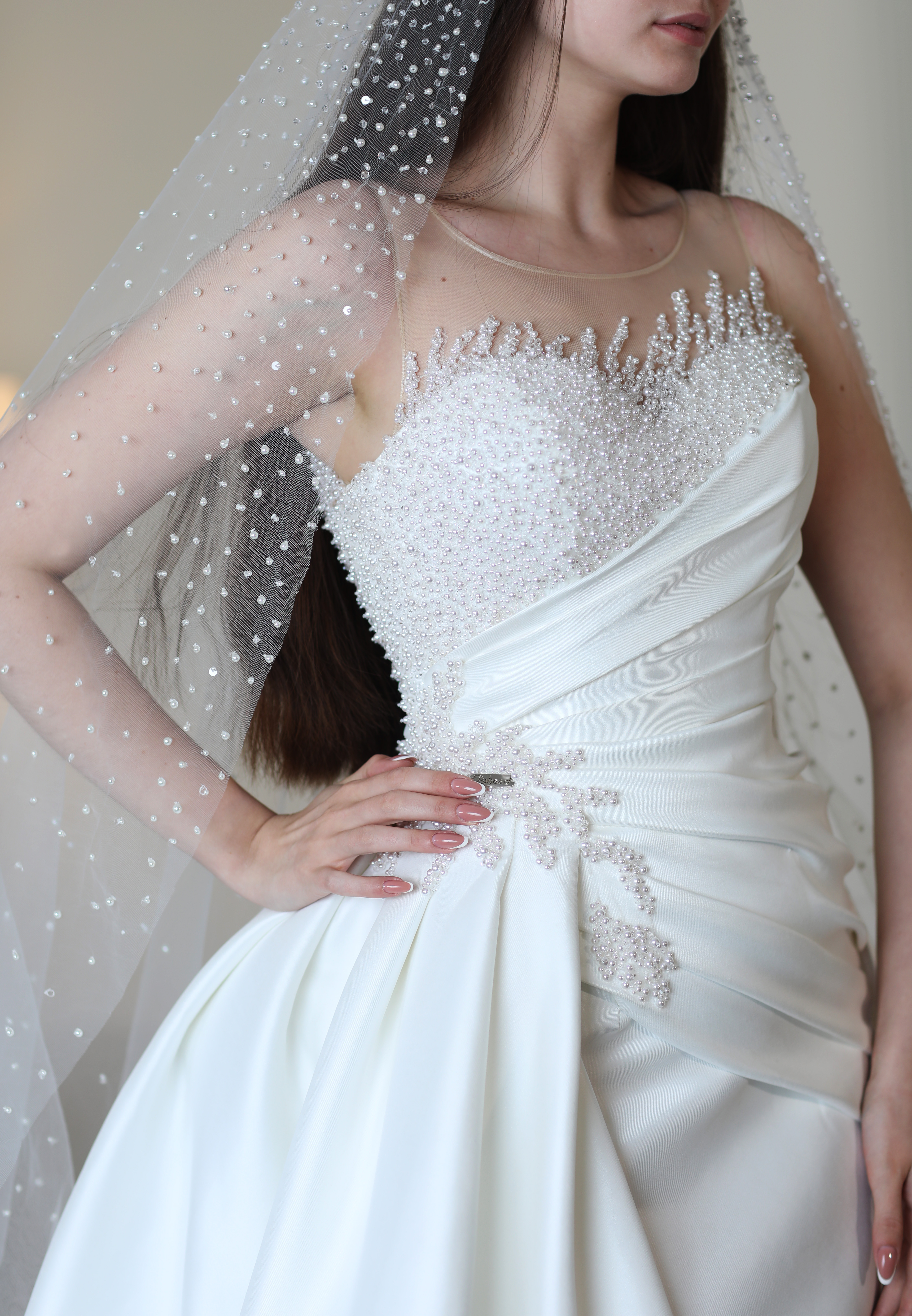 Bride holding the front of a blue and white gown